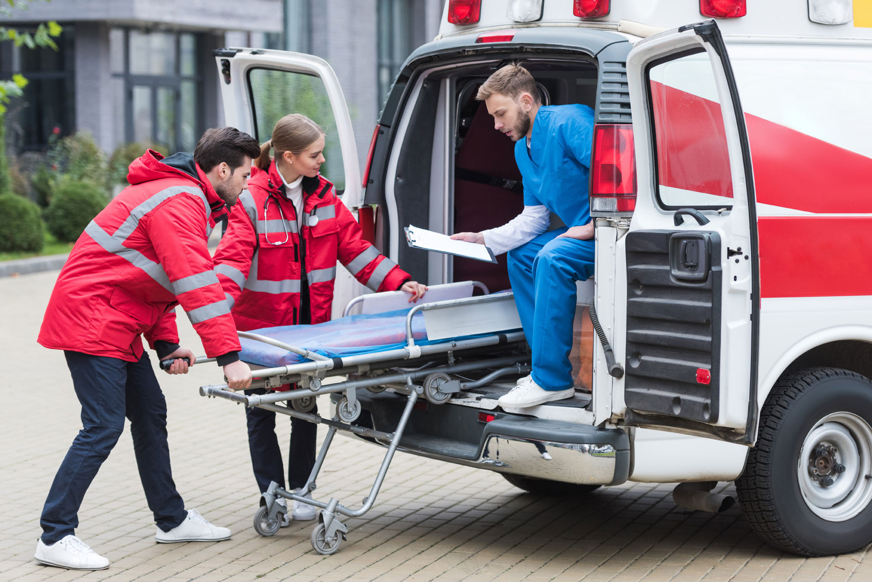 Paramedics Unloading a Stretcher From an Ambulance | Medical Equipment Services in Houston, TX