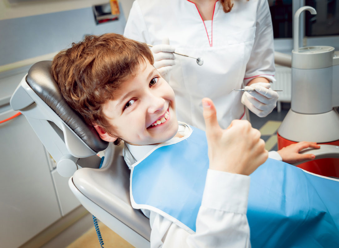 A Little Boy Smiling in the Dental Clinic | Dental Clinics are Covered by Our Medical Equipment Services in Houston, TX
